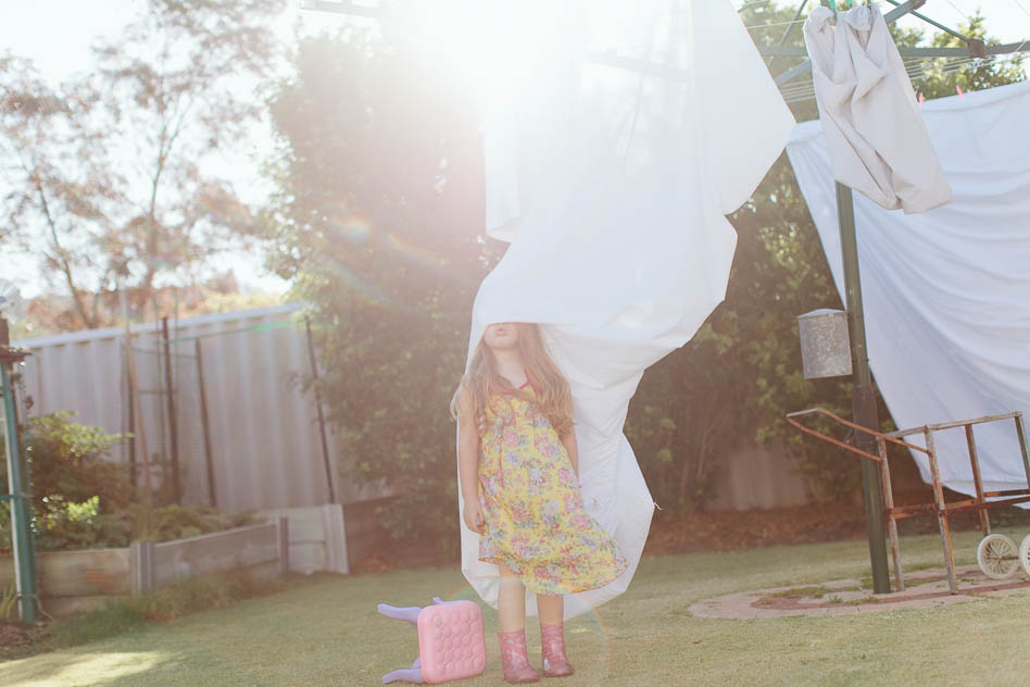 girl playing in washing, lifestyle portraiture, krystle ricci photographer