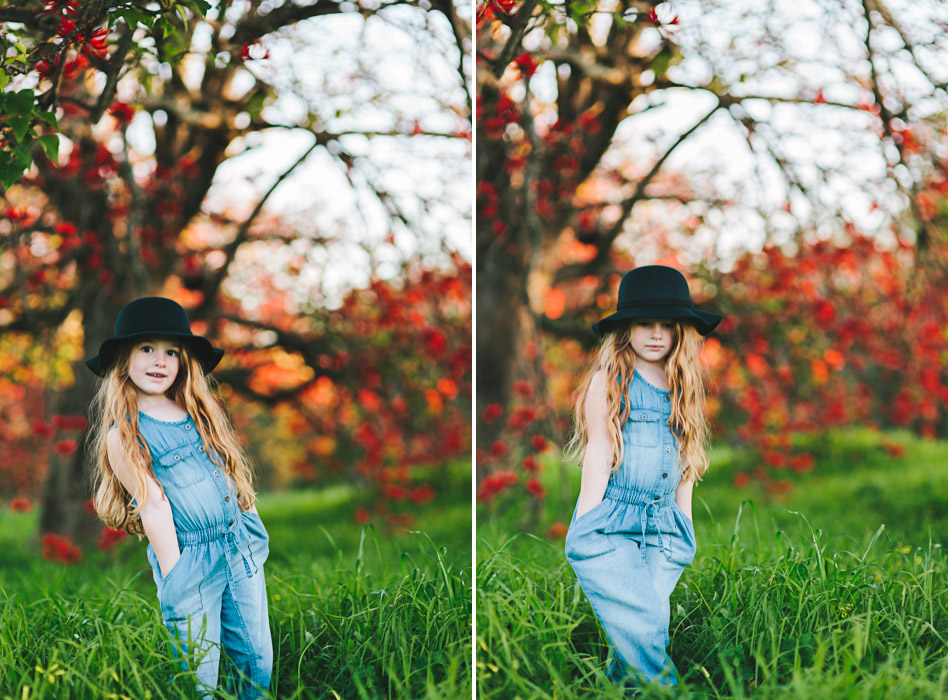 girls wearing black felt bowler hat, standing under flame tree, Brachychiton acerifolius