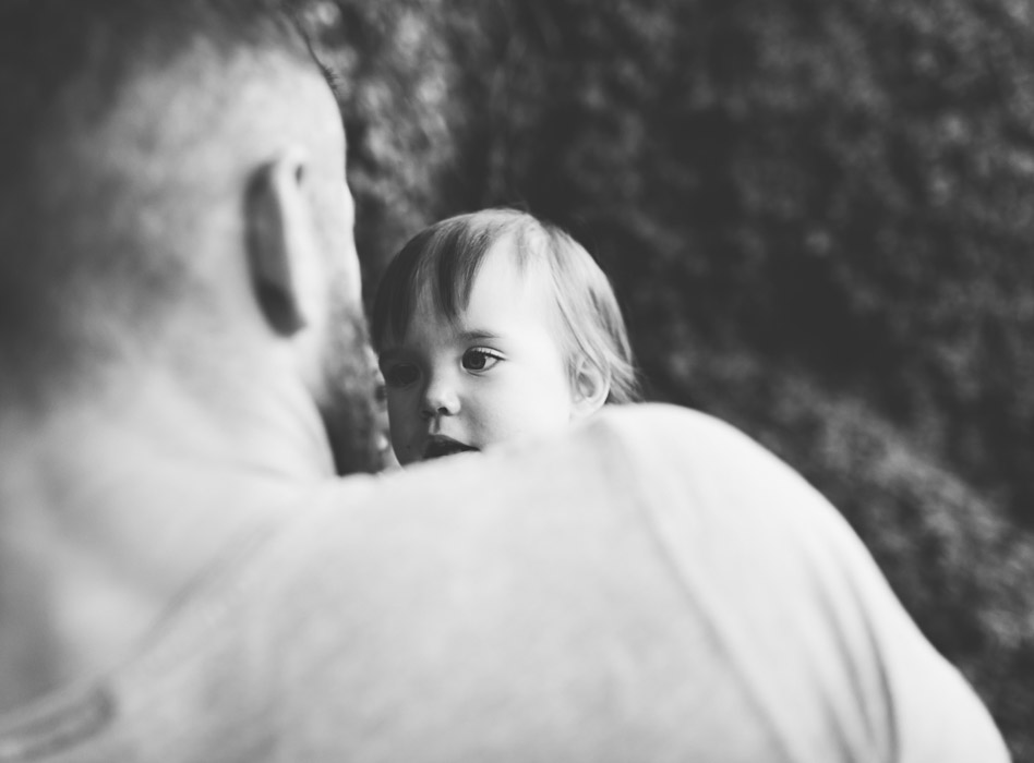 father and baby looking at each other
