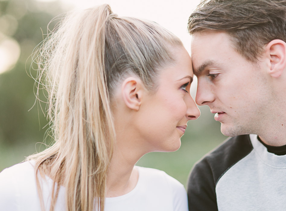 engaged couple posing for photo