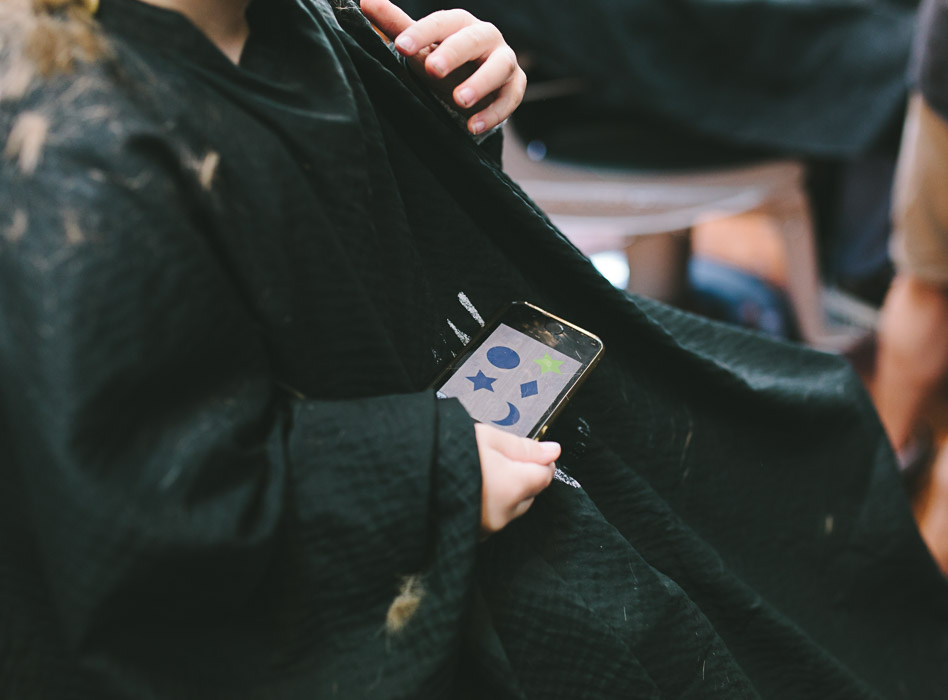 toddler holding iphone