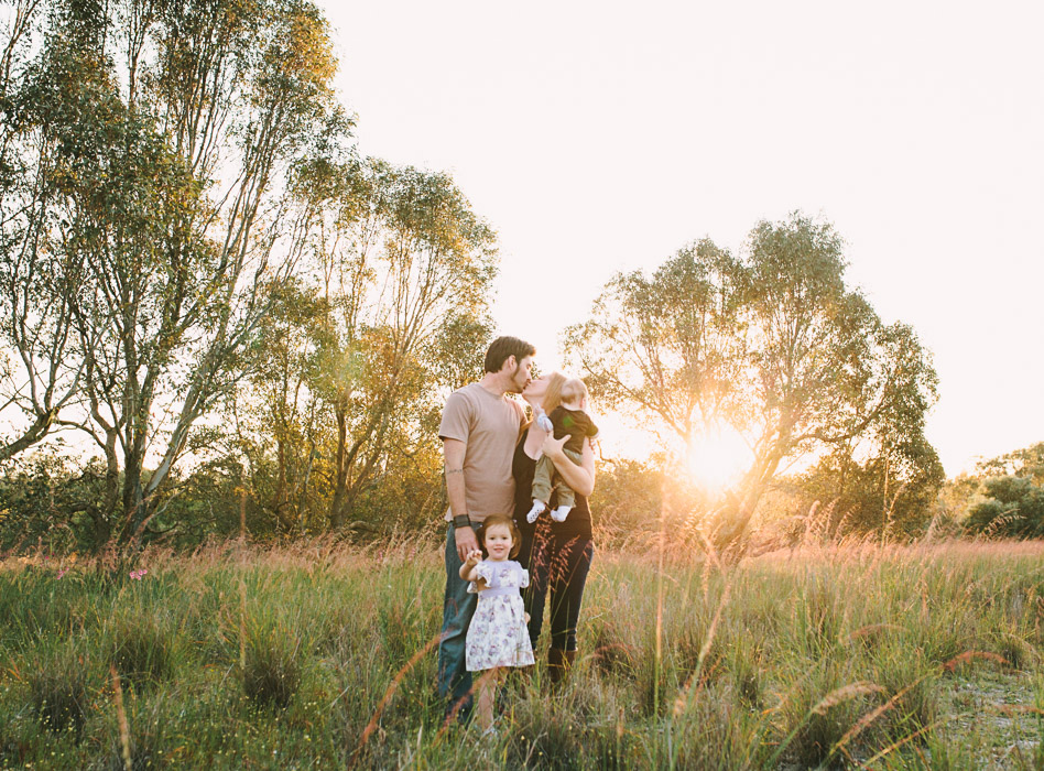 mother father and two children posing for photo perth photographer