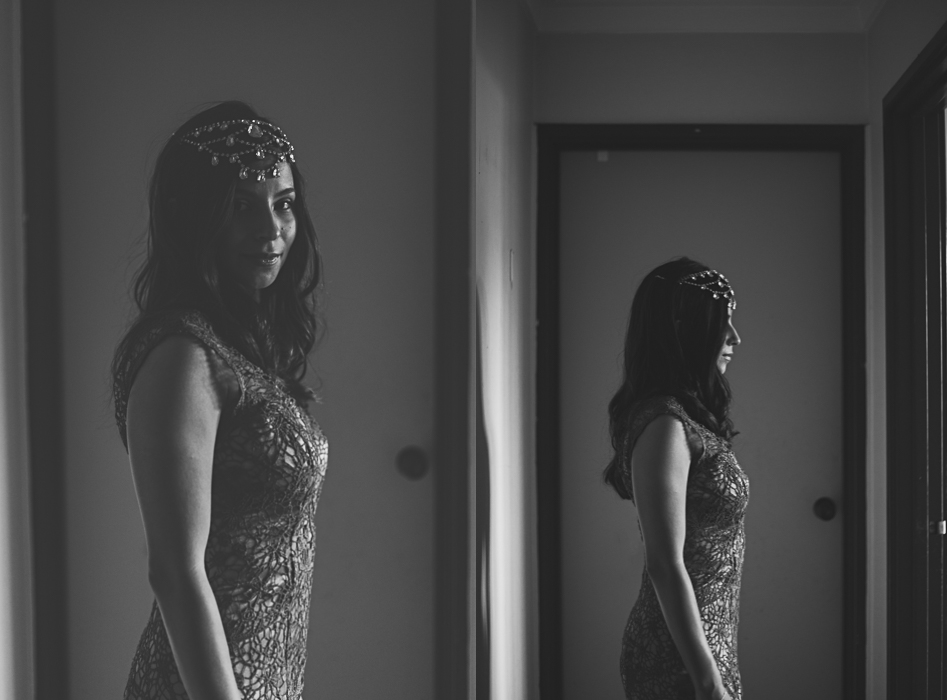 bride poses in doorway