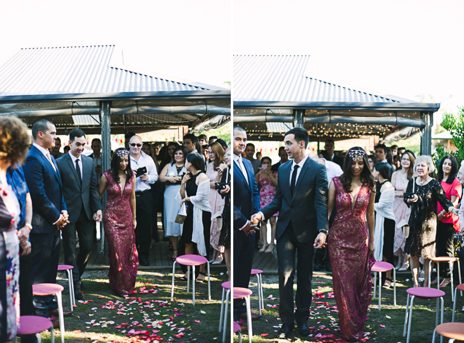 bride and groom walk down aisle