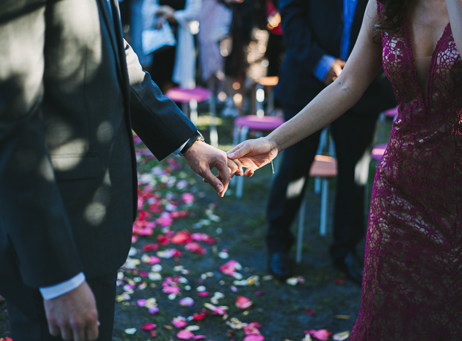 bride and groom holding hands