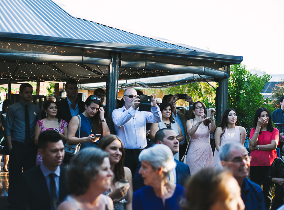 guests taking photos at a wedding