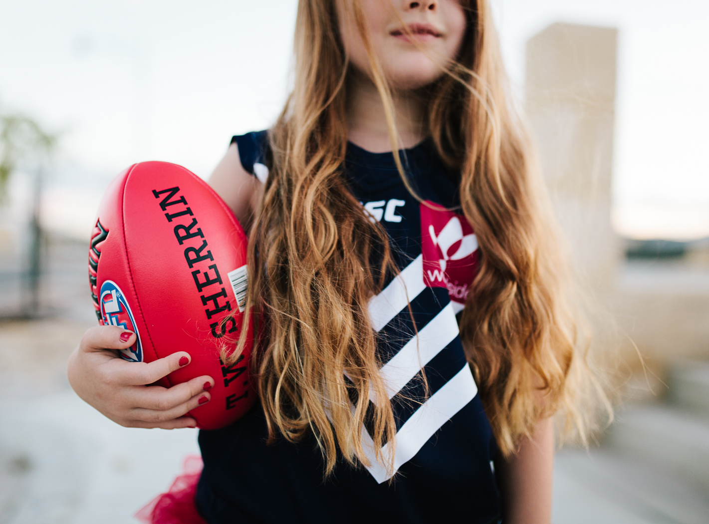 close up of holding kids football