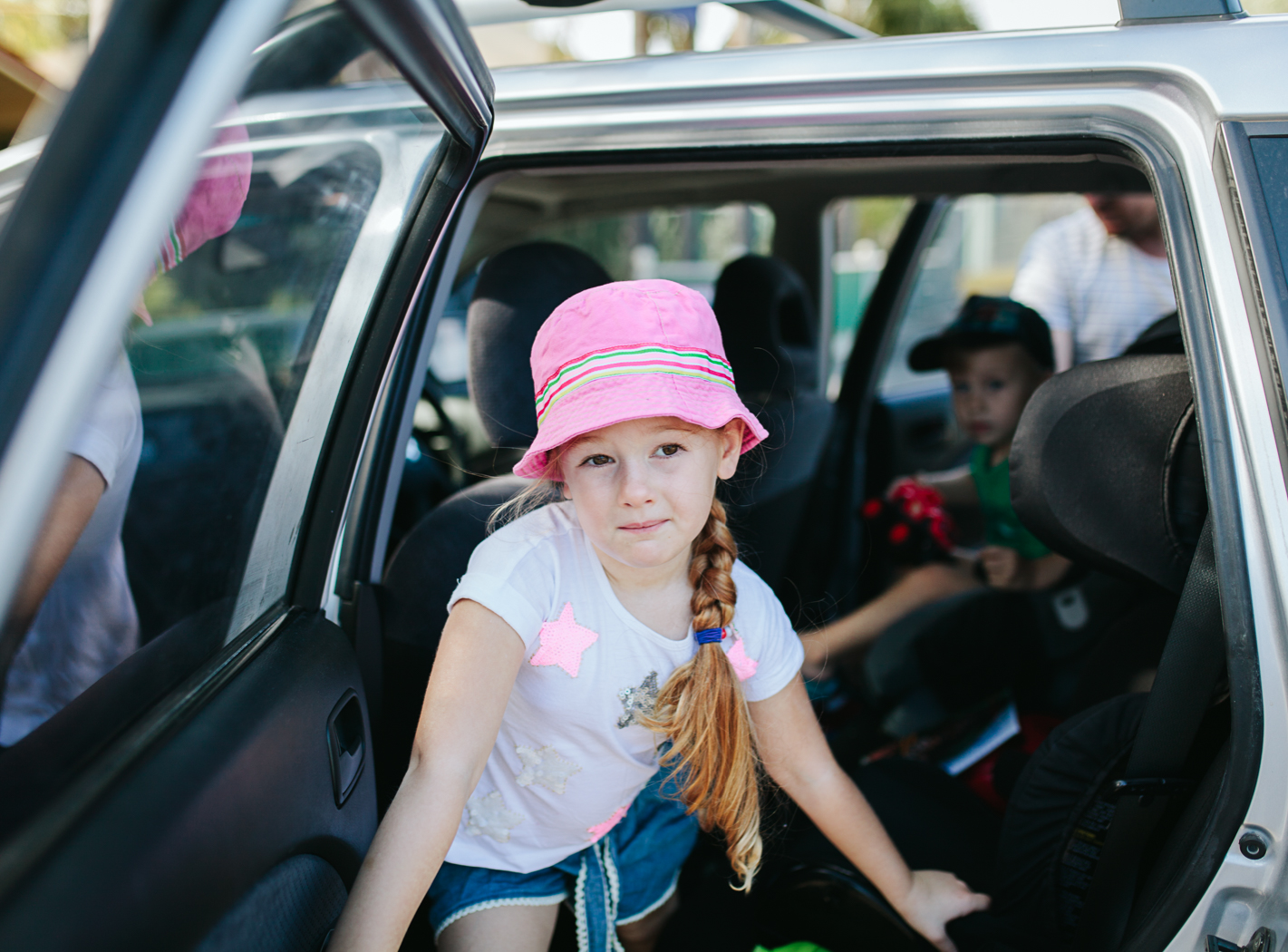 kids getting out of car