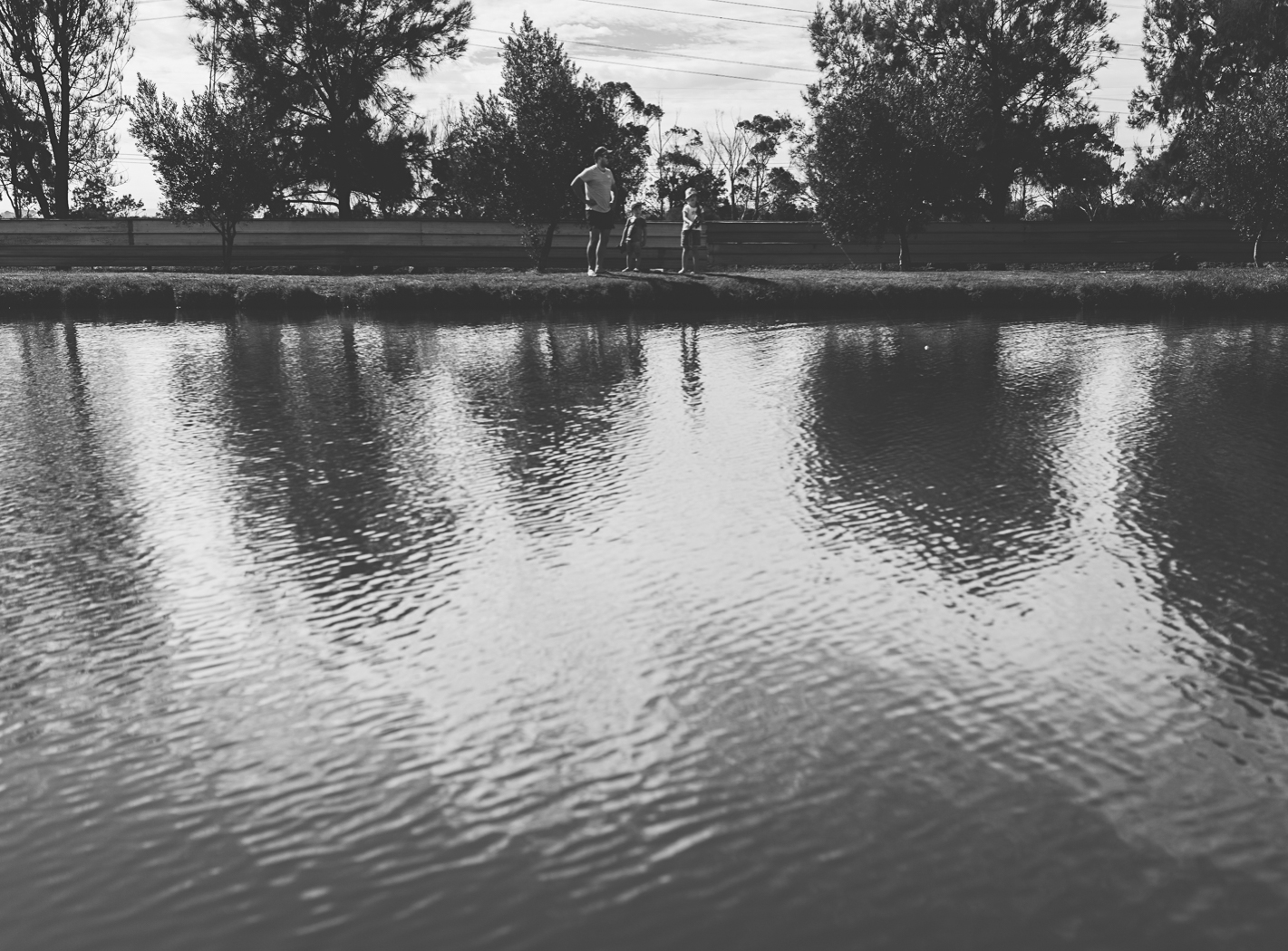 family of three fishing at lifestyle photography shoot