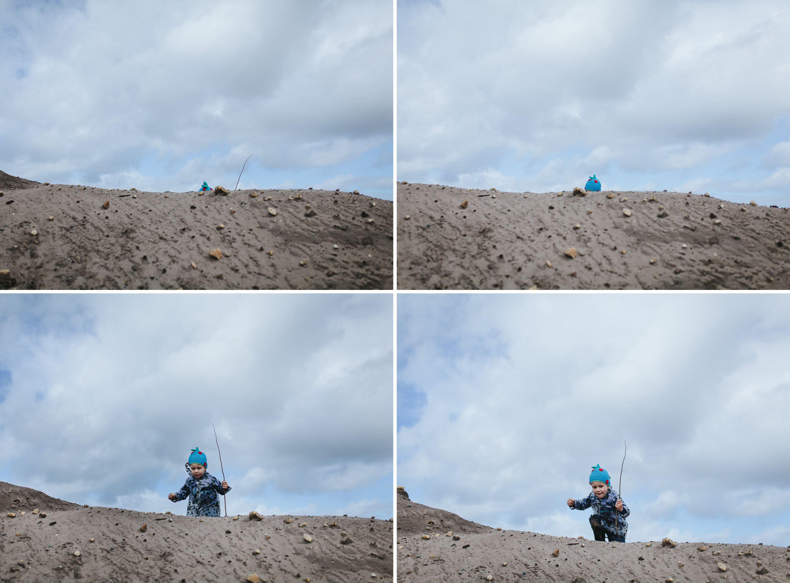 boy climbing sand hills