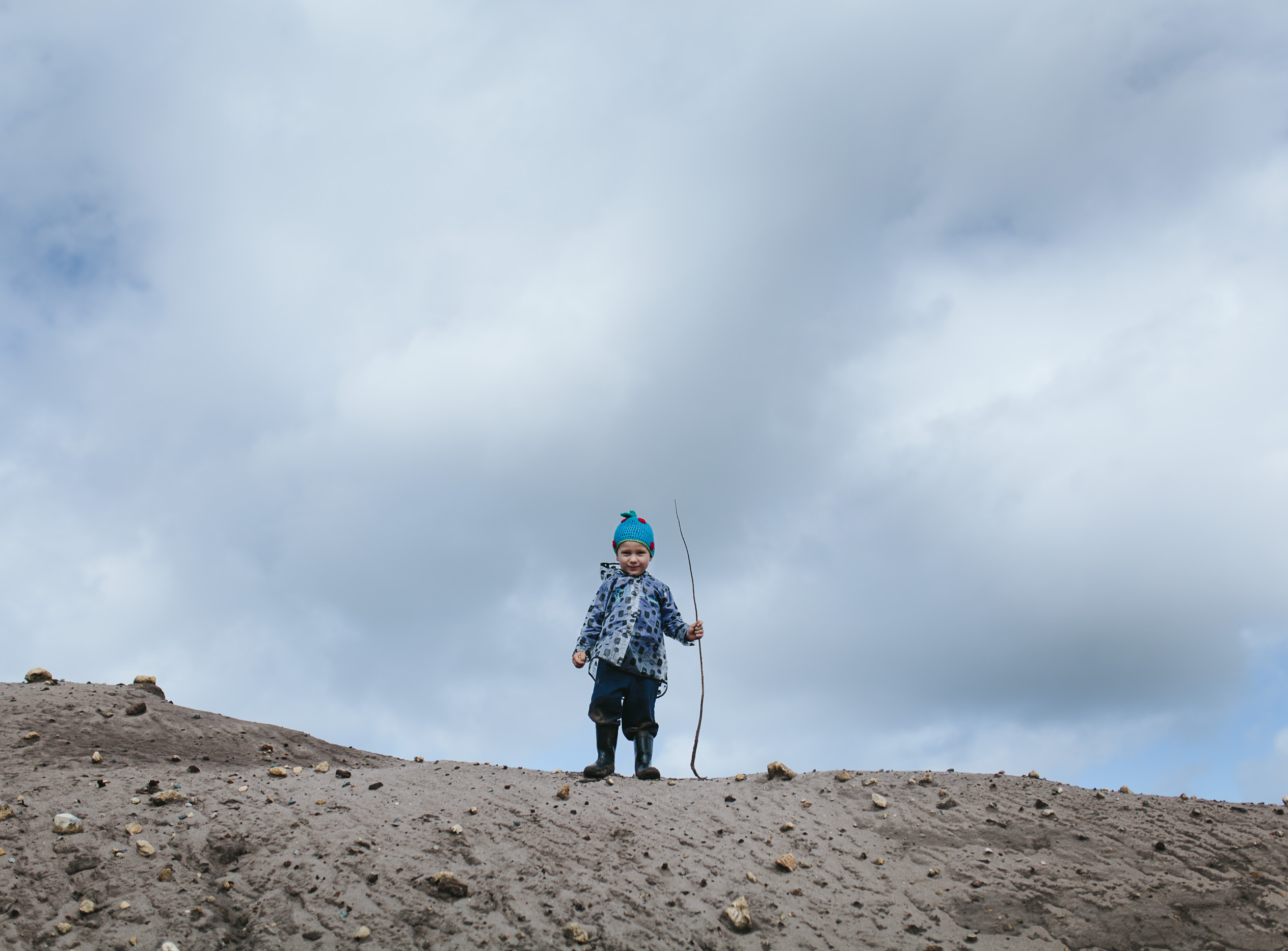 boy reaches top of sand hill krystle ricci perth family photographer