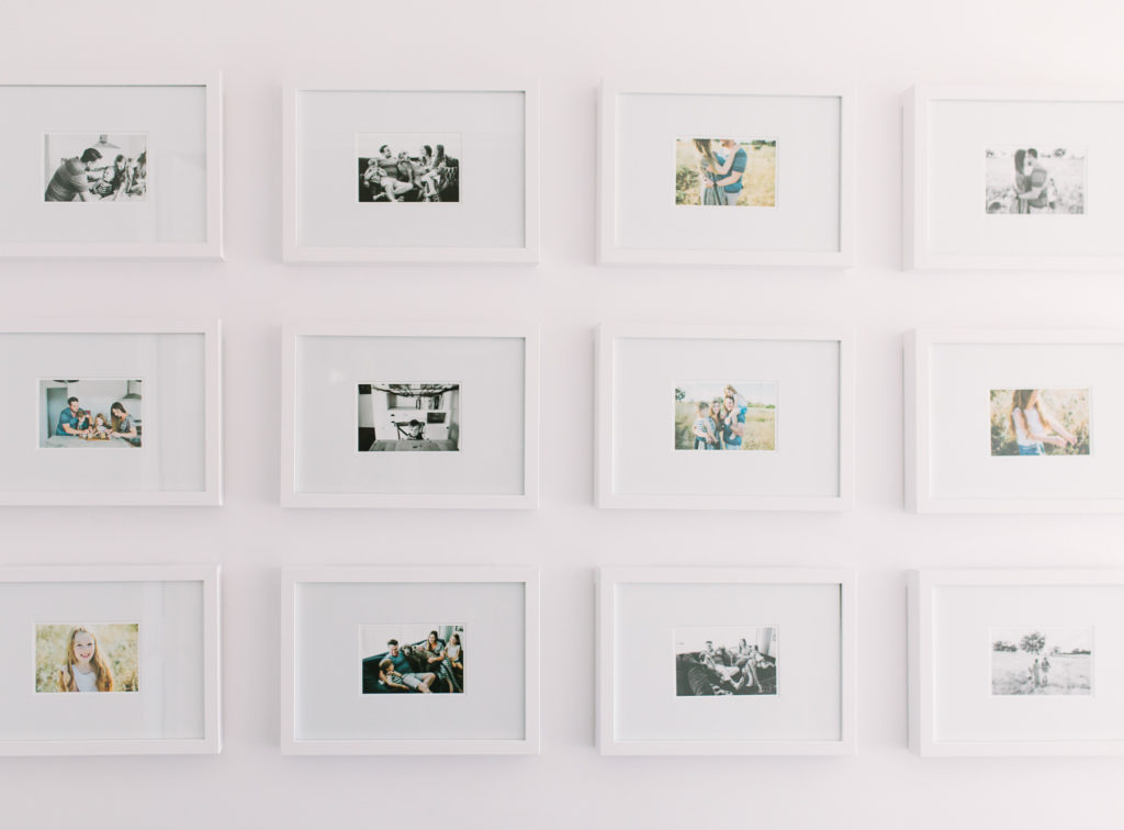 full shot framed white photo wall